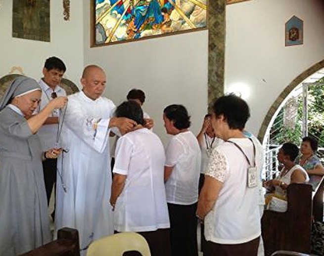 Investiture of the members of the Sacred Hearts of Jesus and Mary conducted by Fr. Kilat and Sr. Eva; assisted by Alex Canoy